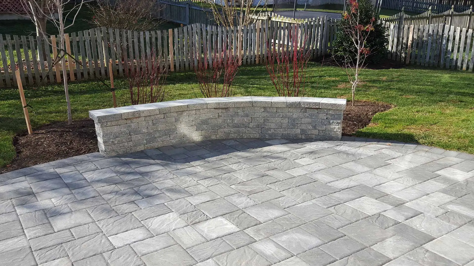 Custom patio with seating wall in Bristow, %%state.