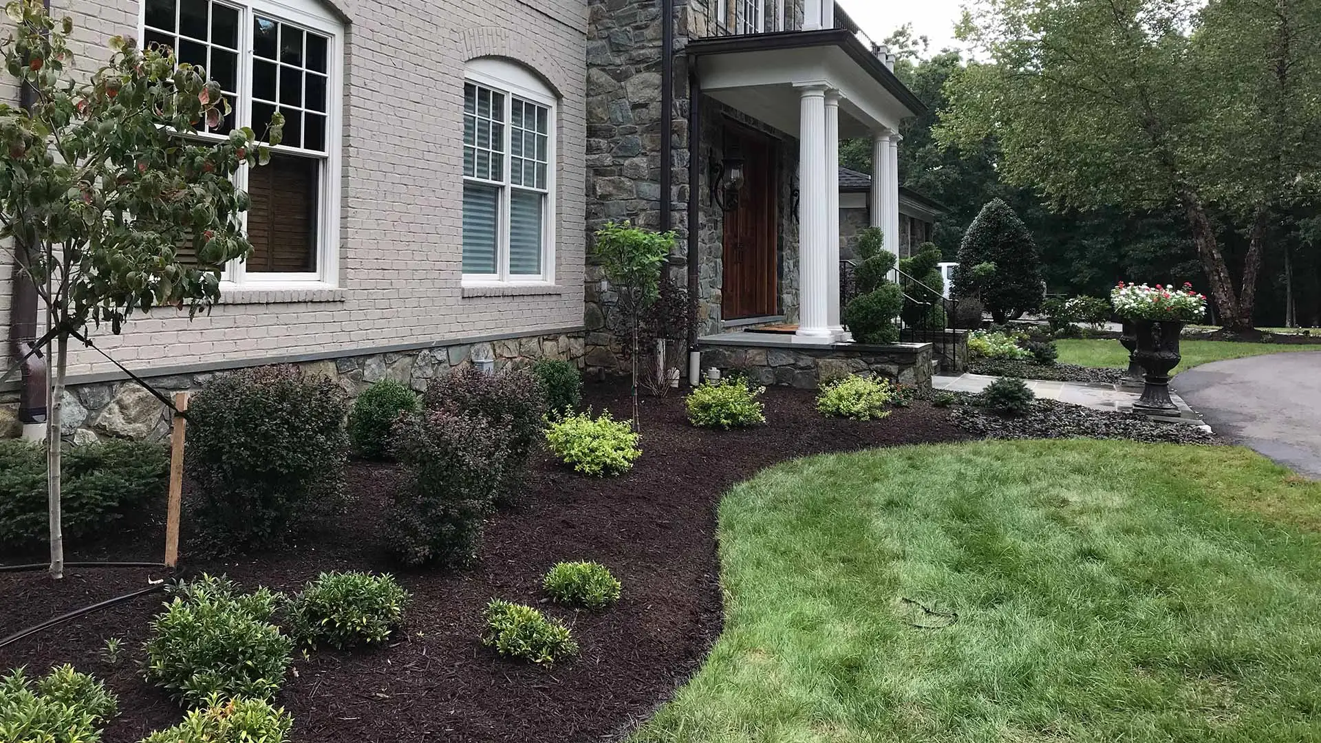 Beautiful landscape bed and mulch installation outside a home in Clifton, VA.