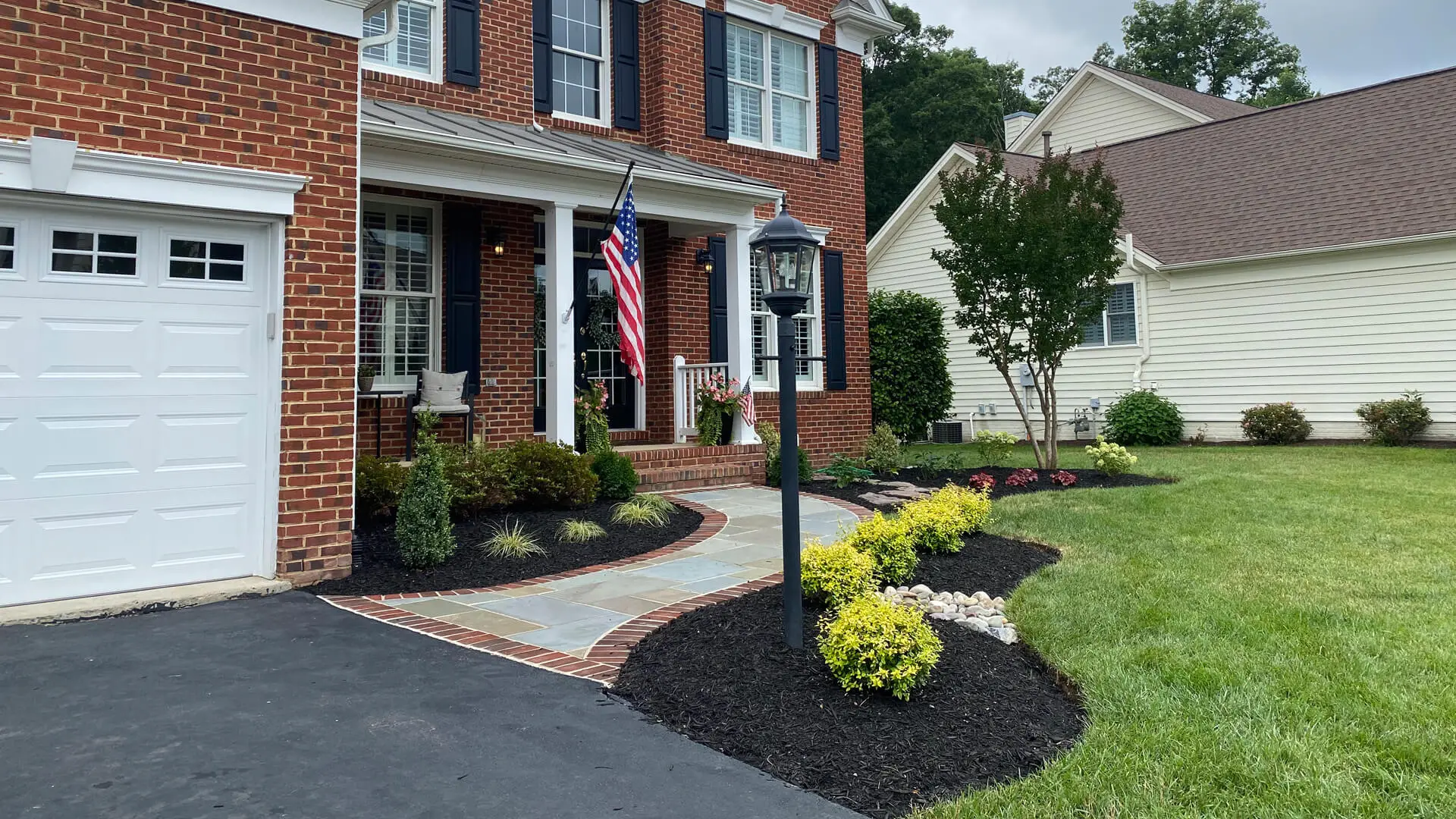 Beautiful landscaping for the front yard of a brick house in Bristow, VA.