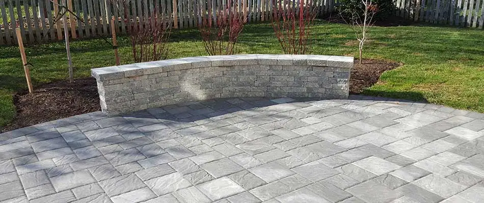 Concrete paver patio design with seating wall near Haymarket, VA.
