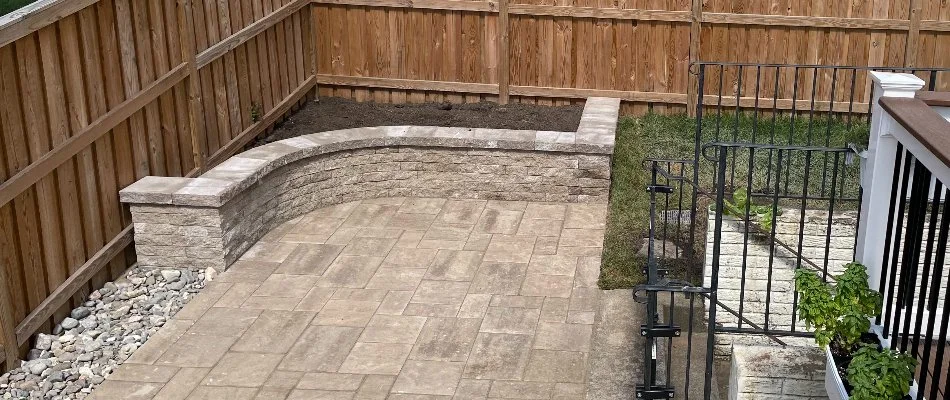 A retaining wall in a backyard on a patio in Bristow, VA.