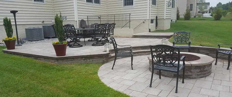 Custom outdoor patio and fire pit installation in Clifton, VA.