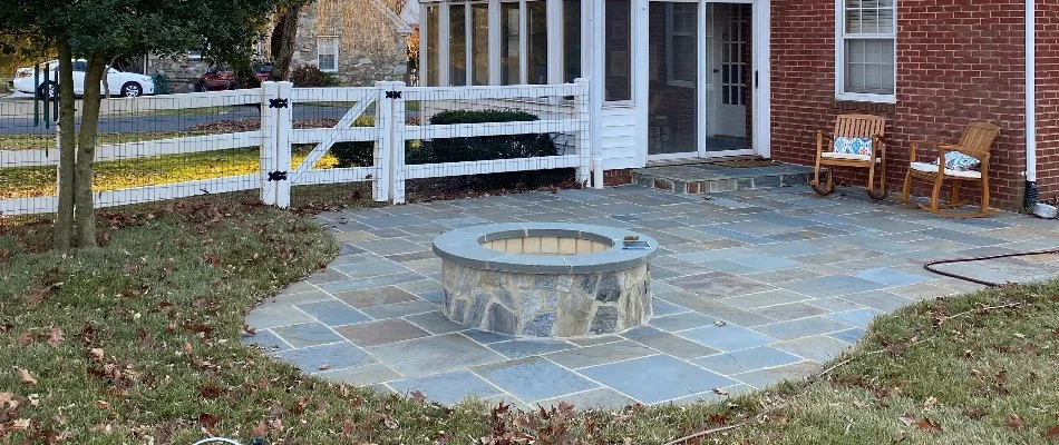 Patio with a fire pit near a fence in Nokesville, VA.