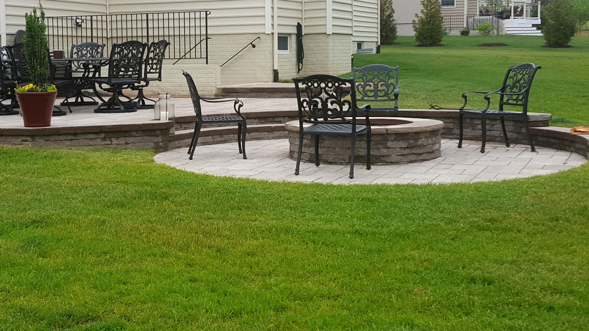 A new fire pit, paver patio, and a seating wall designed and built at a home in Haymarket.